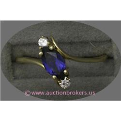 14 K YELLOW GOLD LADIES GEMSTONE RING SET WITH A MARQUISE CUT BLUE SAPPHIRE .50 CT AND ACCENTED WITH