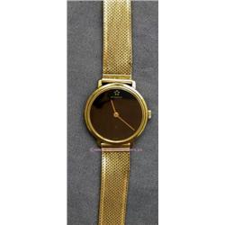 14 K YELLOW GOLD LADIES ETERNA WATCH WITH BLACK FACE. 30.5 GRAMS.