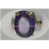 Image 1 : 10 K YELLOW GOLD LADIES GEMSTONE RING SET WITH AN OVAL AMETHYST STONE 20 X 15 MM. 7.7 GRAMS.
