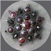 Image 1 : VINTAGE GARNET STONE BROOCH SET IN SNOWFLAKE PATTERN.