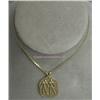 Image 1 : 14 K YELLOW GOLD UNISEX PENDANT WITH RAISED GOLD OUTLINES OF FIGURES HOLDING HANDS. 8.1 GRAMS,