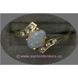 14 K YELLOW GOLD LADIES GEMSTONE RING SET WITH A CENTER OVAL CUT OPAL STONE .47 CT AND ACCENTED WITH