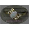 Image 1 : 14 K YELLOW GOLD LADIES GEMSTONE RING SET WITH A CENTER OVAL CUT OPAL STONE .47 CT AND ACCENTED WITH