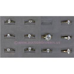 COLLECTION OF GOLD PLATED FASHION RINGS INCLUDING ELEVEN RINGS SET WITH CUBIC ZIRCONIA STONES IN VAR
