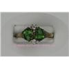 Image 1 : 10 K ROSE GOLD LADIES GEMSTONE RING SET WITH TWO OVAL CUT EMERALDS 6 X 3 MM EACH. 1.4 GRAMS.