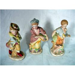 THREE CERAMIC BISQUE FIGURINES OLD WORLD VILLAGE WOMEN. 5.5".