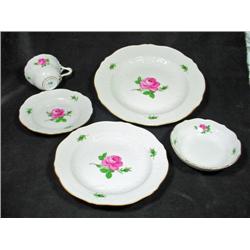 MEISSEN ROSE PATTERN FOUR-PC PLACE SETTING SIGNED WITH CROSSED SWORD MARKS.