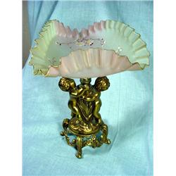 HANDPAINTED RUFFLED EDGE DISH SITTING ATOP A PAIR OF BRONZE FOOTED CHERUB BASE. 9"