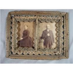 ANTIQUE TRAMP ART DOUBLE PICTURE FRAME WITH ANTIQUE PORTRAITS, MALE AND FEMALE. 12" 9".