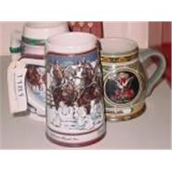 COLLECTION OF THREE COLLECTIBLE BUDWEISER STEINS.