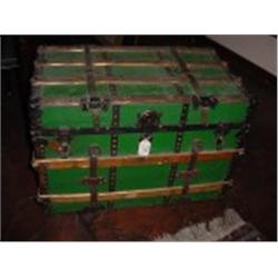 ANTIQUE STEAMER TRUNK MADE BY EAUCLAIRE TRUNK COMPANY WITH LEATHER HANDLES, WOODEN SLATS, METAL CORN