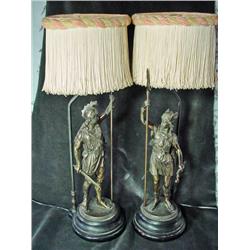 PAIR OF BRONZE VICTORIAN FIGURAL LAMPS DEPICTING A CENTURION MAN WITH ORIGINAL SILK FRINGED SHADES. 
