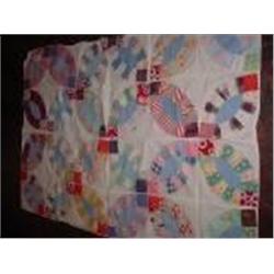 ANTIQUE QUILT TOP IN A FOOTBALL PATTERN 66"X46"