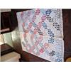 Image 1 : ANTIQUE QUILT IN A MODIFIED OCEAN WAVES PATTERN 79" X 61" WITH A WHITE BACK.