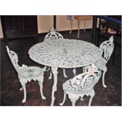 VINTAGE CAST IRON PATIO SET. TABLE IS 26" X 39". FOUR CHAIRS 32".