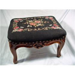 HAND CARVED VICTORIAN FOOTSTOOL CIRCA 1930'S UPHOLSTERED WITH NEEDLEPOINT TAPESTRY IN A FLORAL PATTE