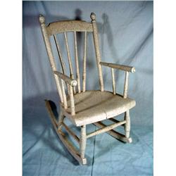 SIXTY NINE YEAR OLD CHILD WOODEN CHILD ROCKER 26" X 22"