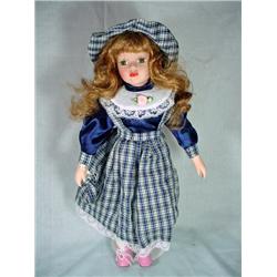 CERAMIC DOLL WITH PLAID DRESS 15". STAND INCLUDED.