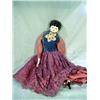 Image 1 : DOLL WITH PORCELAIN FACE AND HANDS, LEATHER LIKE BODY OF DOLL WITH LONG DRESS (FOOT REQUIRES REPAIR)