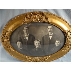 Antique oval picture frame with curved glass, 13" h x 19" w