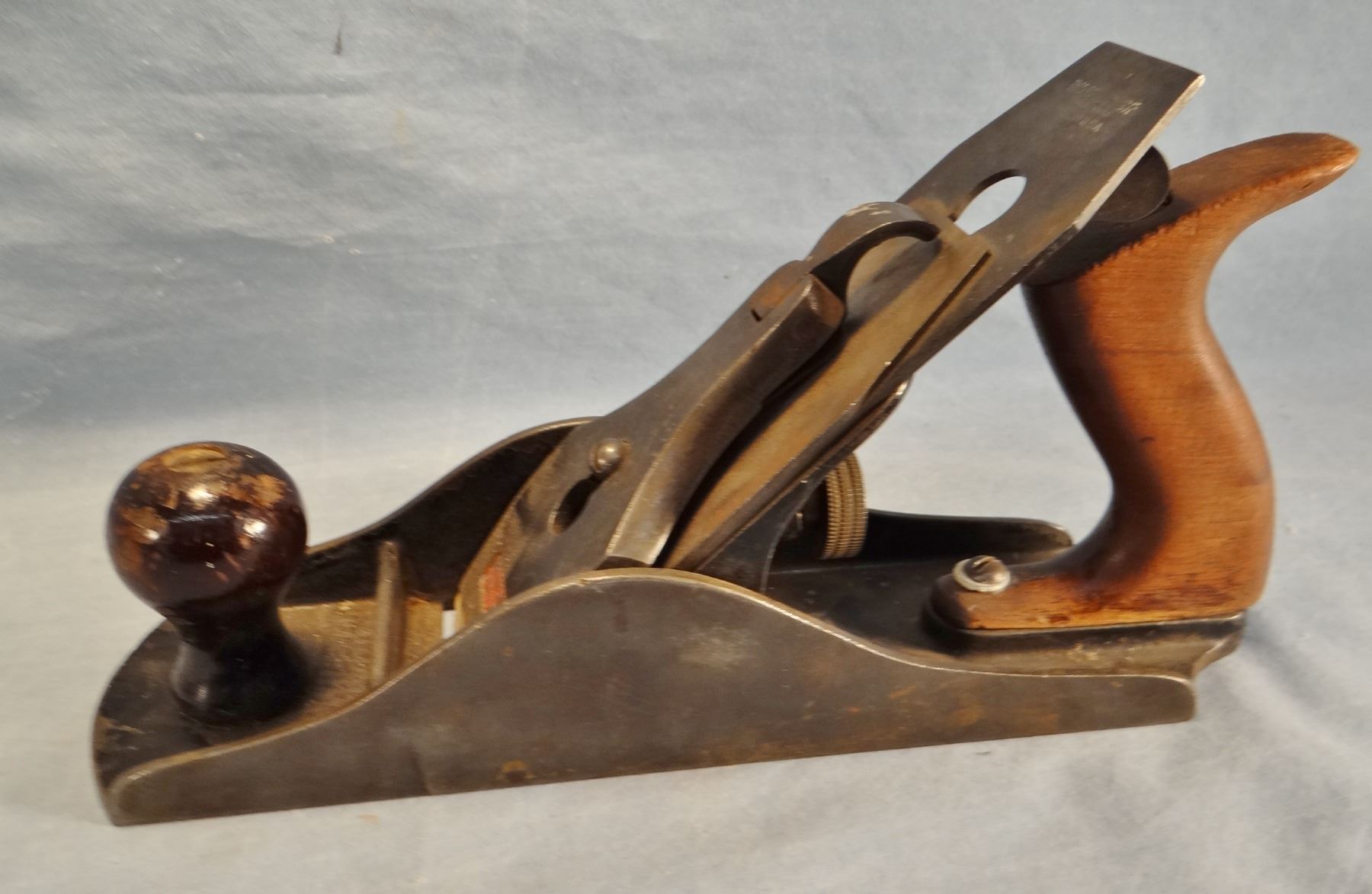 Winchester wood plane, 11" and Lewistown, MT souvenir cup, pewter, 3 1/2" h