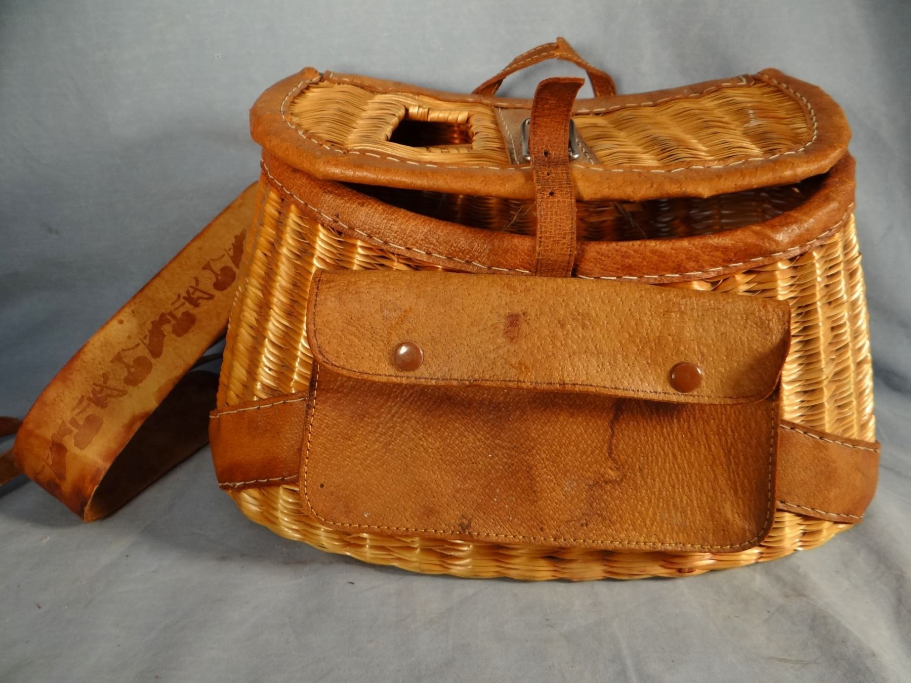 2 older fishing creels w/original shoulder harness and 1920's fly