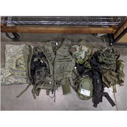 SHELF OF PAINTBALL GEAR INCLUDING CAMOUFLAGE, UTILITY CLOTHING, PADDING AND MORE