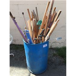 BLUE PLASTIC BARREL FILLED WITH ASSTD DOWELS, GOLF CLUBS & MISC. ITEMS