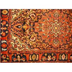 AN ORIENTAL STYLE RUG
