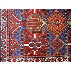 AN ORIENTAL STYLE RUG