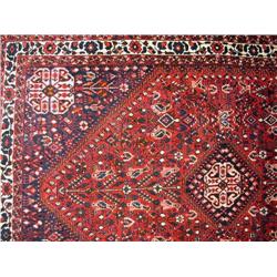 AN ORIENTAL STYLE RUG