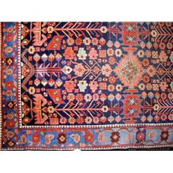 AN ORIENTAL STYLE RUG