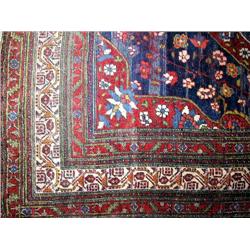 AN ORIENTAL RUG