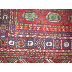 A ROOM SIZE BOKHARA STYLE RUG