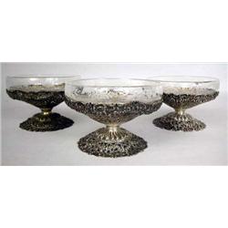 TWELVE 800 GERMAN SILVER RETICULATED REPOUSSE SHERBETS: with three etched glass inserts, dents, 2"h 
