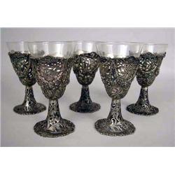 TWELVE STERLING SILVER RETICULATED FOOTED CORDIALS