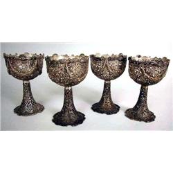 A SET OF TWELVE STERLING SILVER RETICULATED WINE GLASSES