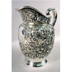 AN AMERICAN STERLING SILVER WATER PITCHER BY S. KIRK & SON