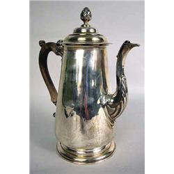 AN ENGLISH SILVER GEORGE II COFFEE POT