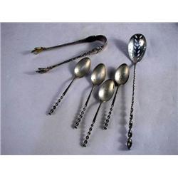 A PAIR OF TIFFANY AND COMPANY STERLING SILVER SUGAR TONGS