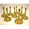 Image 1 : EIGHT NEARLY IDENTICAL CAST BRASS DOME-BASE CANDLESTICKS