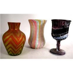 A PURPLE SLAG GLASS GOBLET