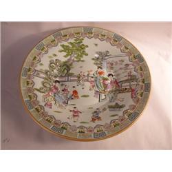 AN EXTREMELY LARGE POLYCHROME-DECORATED CHINESE EXPORT CIRCULAR SERVING DISH