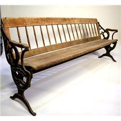 A MAPLE AND CAST IRON REVERSIBLE RIVERBOAT BENCH