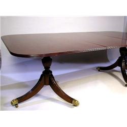 A FEDERAL CARVED MAHOGANY TWO-PEDESTAL DINING TABLE