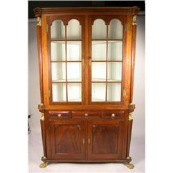 AN EMPIRE ORMOLU MOUNTED CHERRYWOOD CORNER CUPBOARD