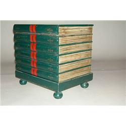 A GREEN PAINTED AND PARCEL GILT DECORATED BOOK FORM OCCASIONAL TABLE