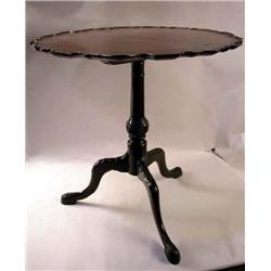 A GEORGE II CARVED OAK PIECRUST TEA TABLE