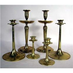 TWO PAIRS OF CAST BRASS ARTS AND CRAFTS CANDLESTICKS