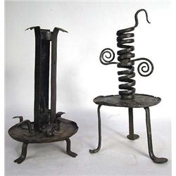 A SET OF TWO WROUGHT IRON CANDLESTICKS